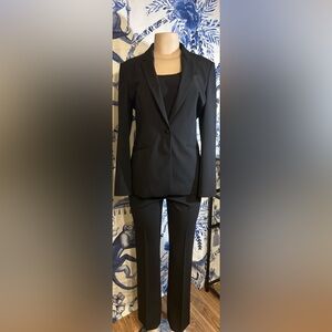 Boss/ Hugo Boss Classic Black Suit with Gold Logo Plate on Back of Jacket.